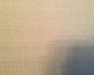 CLOSE UP OF WHEAT COLOR FABRIC ON HEADBOARD