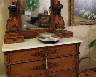 Oak vanity, marble top, beveled mirror back with lamp stands