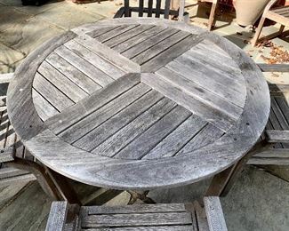 Giati “Paradisio” teak table 29.5" H x 48" diameter