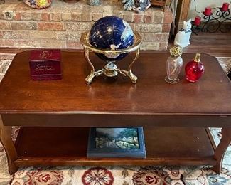 some nice coffee, end and occasional tables with lots of collectibles and knick-knacks.  Gorgeous area rug