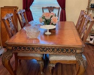 Table with 2 leafs, 6 chairs and matching china hutch