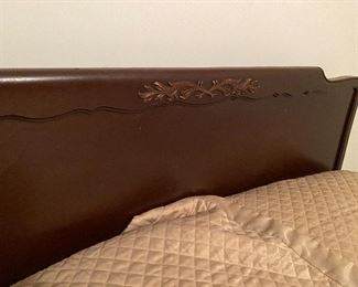 Close-up view of headboard to full-size bed.
