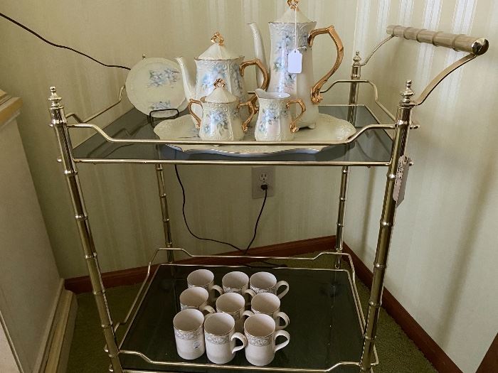 Metal and glass teacart (teacart still available) with (beautiful Tea/coffee/Chocolate set/Japan sold ) and Royal Doulton coffee mugs. New Romance 'Gabrielle'.