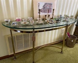 metal and glass sofa table or buffet table.  Demitasse cup and saucers