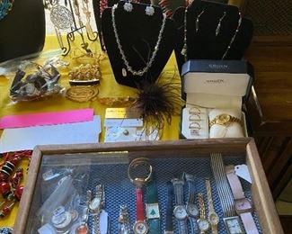 more costume jewelry and wristwatches