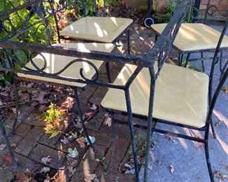 Wrought iron table and chairs.  No glass for table top.