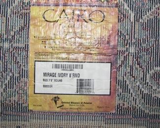 Rug under dining table (go to first picture)  7' 8" round