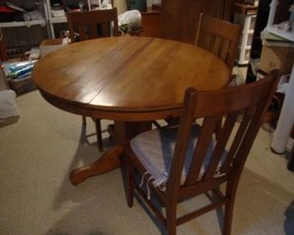 Pedestal table with antique chairs