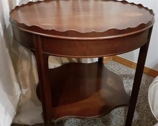 Scalloped edge wooden table