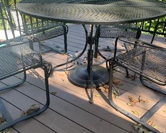 #26- Wrought iron table and 4 chairs w/ umbrella- $200
