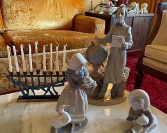 Lladro figurines. The Menorah and eskimo are sold.