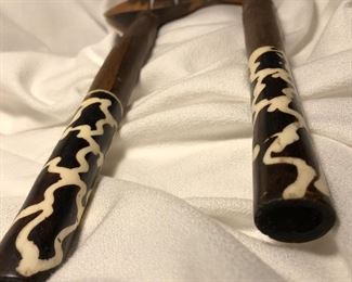 African and not sure what the material is on the handles.