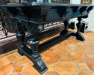 #35 - $495 Continental Ebony carved table   • 31high 58wide 35deep