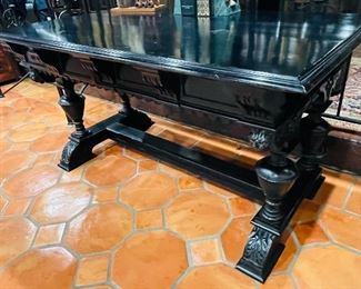 #35 - $495 Continental Ebony carved table   • 31high 58wide 35deep