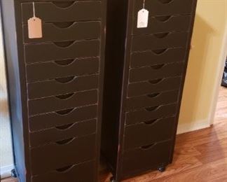 Black distressed cabinets with drawers, decor