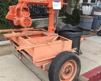 mobile radial arm saw with rolling infeed and outfeed tables