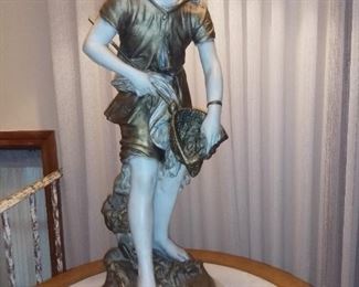 Figural girl at the beach catching shells, a table lamp,