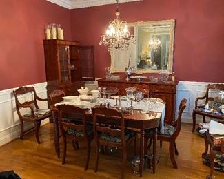 Dining table with 8 chairs and 2 leaves.