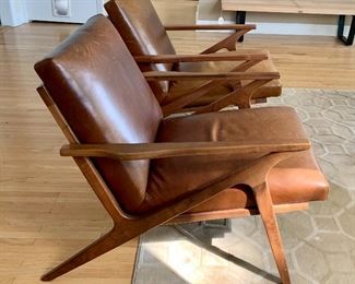 Pair of Crate & Barrel Cavett Leather Chairs, wood frame in Sumatra.

Both chairs are in good overall condition with light wear to the leather; providing a distressed look. One chair has more wear than the other. 

Measurements: arm to arm 25” and about 29.5” overall height. 