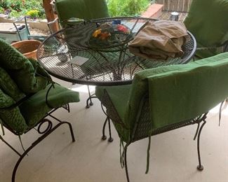 Outdoor metal dining set and green cushions