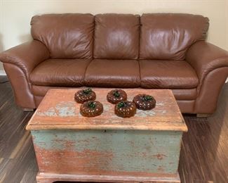 Leather sofa and rustic trunk coffee table