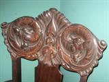 Magnificient antique carved wood chair with what I believe is dragons.