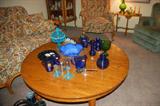 Round Oak Coffee Table and cobalt Blue Various Glassware