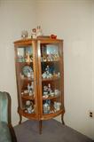Corner China Cabinet full of Collectibles and S & P's, Pres. Plates, Hummel, Plates, Depression Glass, Bells, Figurines and More