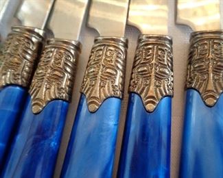 close-up of Gibson flatware cobalt blue  handles