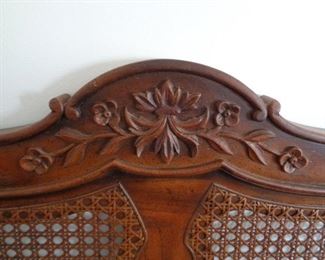 cane and floral design on headboard
