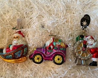 Christopher Radko                                                                     
118) Santa in sleigh with gold runners  48.                                                                                      119) "Comin to Town" 80.                                                      
120) "Cheery Gear Changer"55. 
