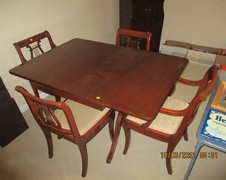 Duncan phyfe table and four chairs