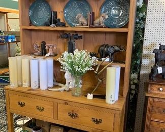 Newer Pine hutch, teal plates, unique book ends, tall wax candles, flower vases
