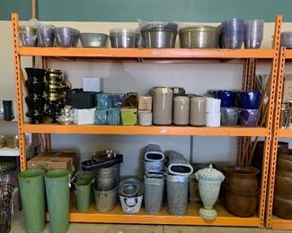 Nice large assortment of plastic basket liners, ceramic planters, metal planters, and even the orange shelves!