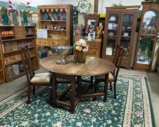 Oval gate leg table, assortment of miscellaneous chairs, lots of beautiful wood display cases