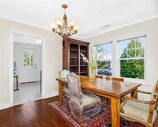 Wood dining table with 4 chairs, wood bookcase, oriental rug