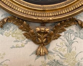 Regency Period Convex Mirror. Flanked by Gilt Wood Girandole Arms. Apron is Flanked by Florettes. English Circa 1820. Measures 40" W x 48" H. Photo 5 of 5.