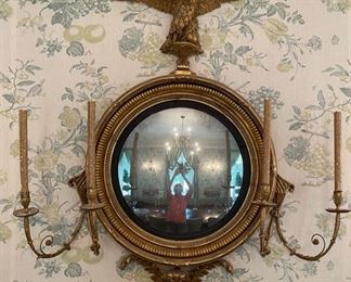 Regency Period Convex Mirror. Flanked by Gilt Wood Girandole Arms. Apron is Flanked by Florettes. English Circa 1820. Measures 40" W x 48" H. Photo 1 of 5.