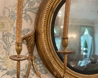 Regency Period Convex Mirror. Flanked by Gilt Wood Girandole Arms. Apron is Flanked by Florettes. English Circa 1820. Measures 40" W x 48" H. Photo 2 of 5.