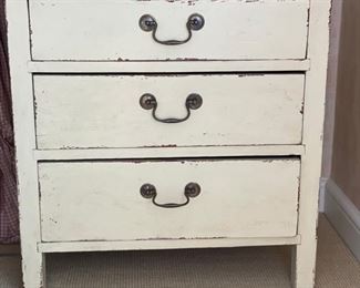 Three-Drawer Distressed Finish Bedside Table. Measures 29" W x 19" H x 30" H. Photo 1 of 2.