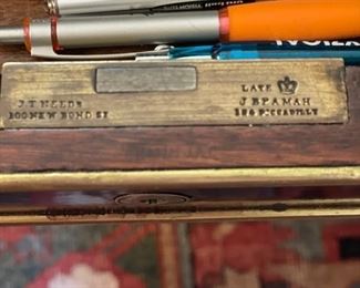 Empire French Mahogany Desk with Brass Mounts Stamped: J.T.Needs, 100 New Bond Street, London. & Late J. Bramah, 186 Piccadilly. Leather Topped with Brass Trim. Measures 60" W x 34" D x 31" H with 25" Clearance. Circa 1840. Photo 2 of 8.