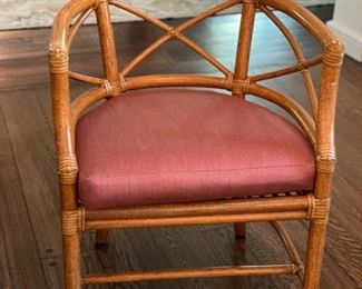 Pair of Cane and Wicker Arm Chairs with Cushions. Each Measures 22" W x 22" D. Photo 1 of 2.