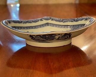 Antique Flow Blue Footed Oval Bowl. Measures 9" x 9". Photo 1 of 2.