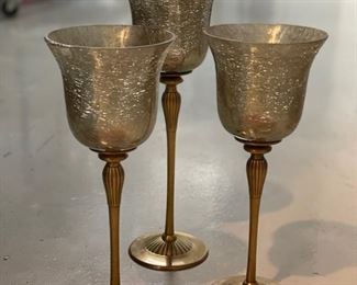 Set of three pedestal candlesticks. Two measure 12"H; one measures 13.5"H.