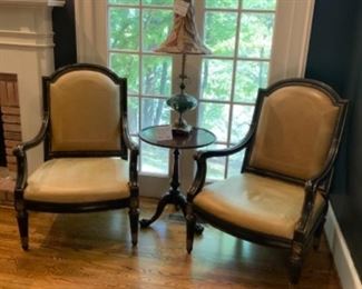 Pair Leather french armchairs -their back is silk embroidery but the embroidery on both are torn.      $1,500  Pair   