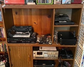 Entertainment Center; Magnovox VHS/DVD Player ZV427MG9; Emerson VCR EWV401; Magnovox VCR 4 Head VRU342AT21; Orion 4 Head VCR VR5006; Magnovox DVD Player DP100MW8B; Sanyo Blu-Ray