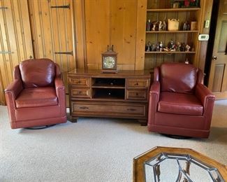 Pair leather swivel club chairs by Leathercraft