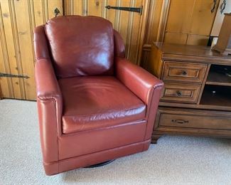 Pair leather swivel club chairs by Leathercraft