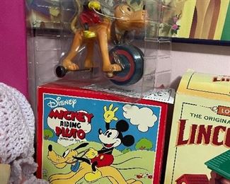 Vintage Disney Mickey riding Pluto wind up toy with original packaging 