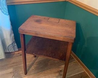 Small wood side table with some damage to top